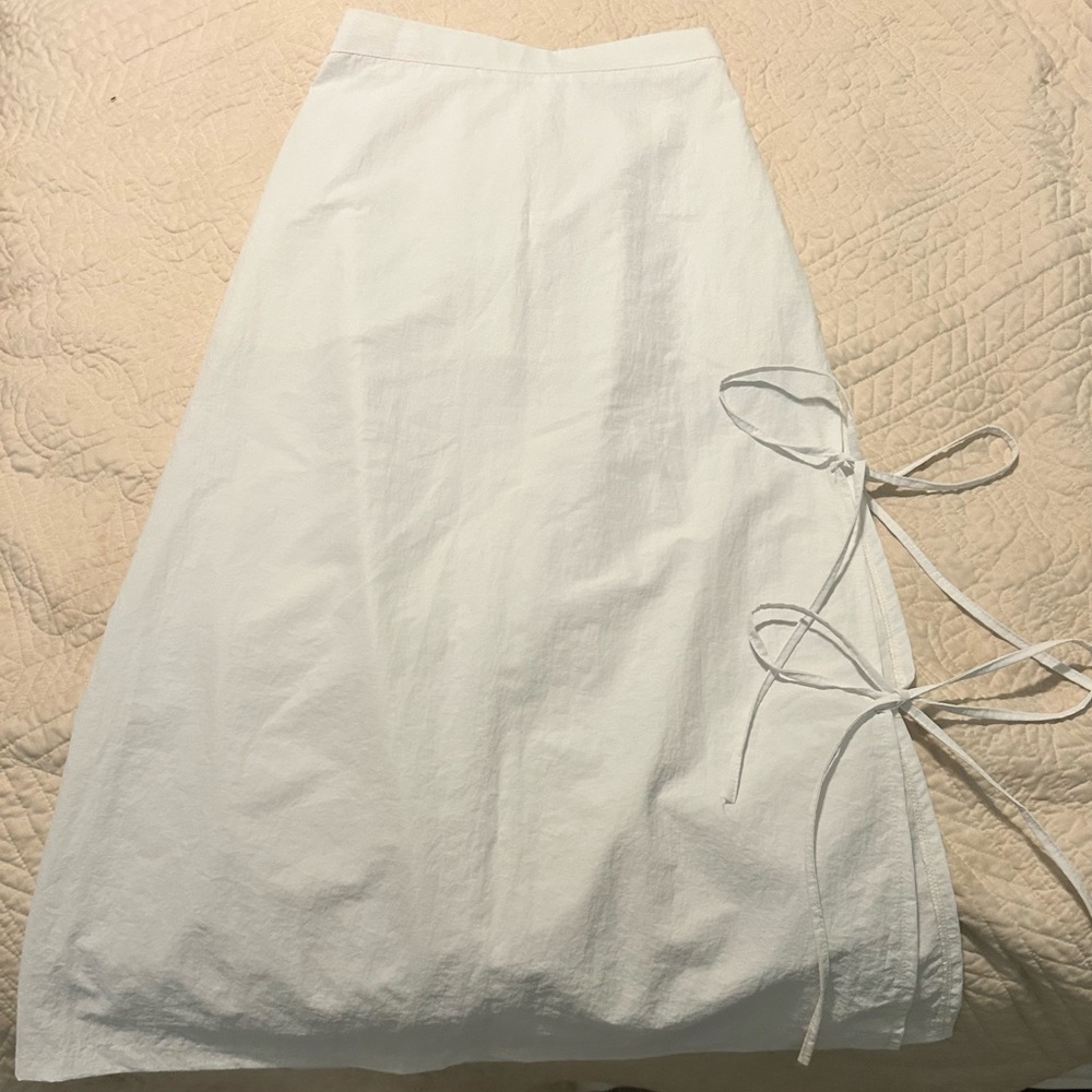 White maxi skirt with ties you can undo and has an extra layer underneath